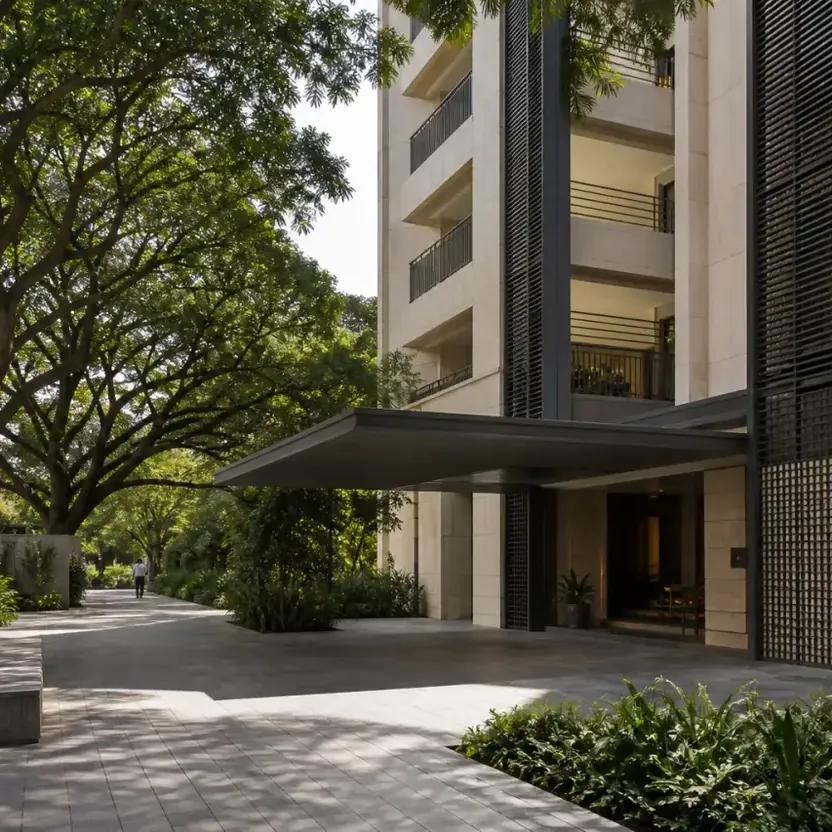 An arrival court under a canopy with mature trees