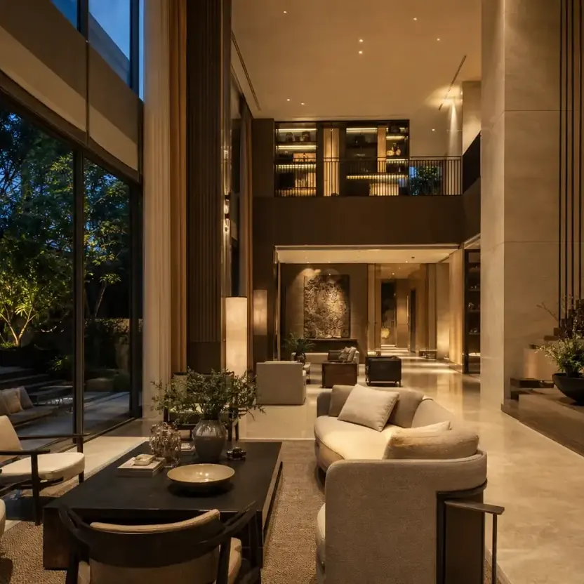 A double-height lounge with a staircase